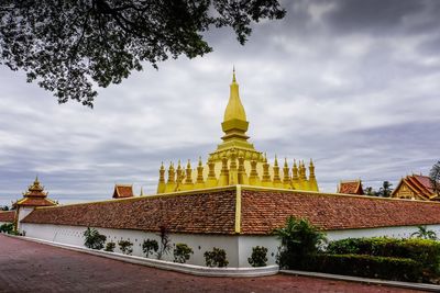 View of temple building against cloudy sky