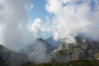 Smoke emitting from volcanic mountain against sky
