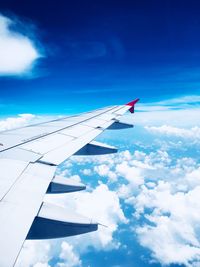 Low angle view of airplane flying in sky