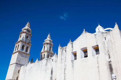 Low angle view of church against blue sky