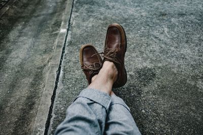 Low section of man standing on floor