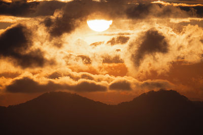Low angle view of dramatic sky during sunset