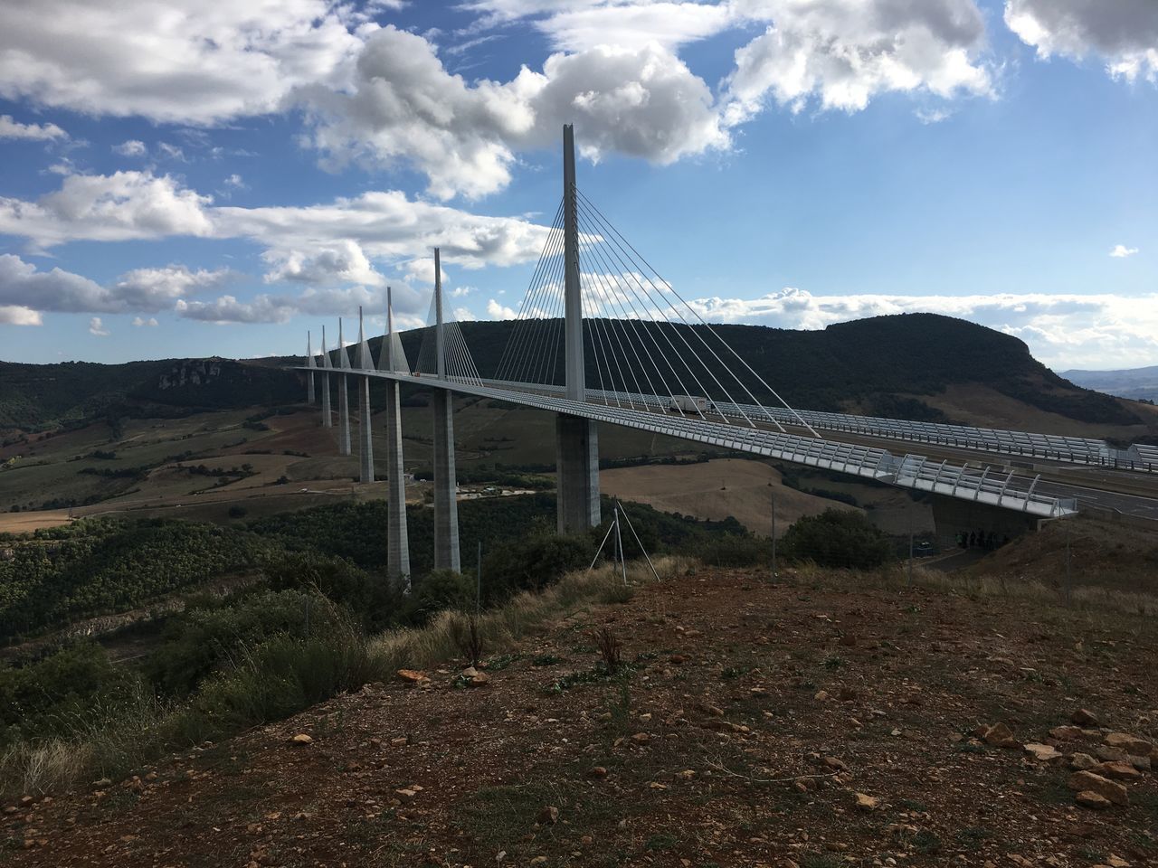 BUILT STRUCTURE ON MOUNTAIN AGAINST SKY