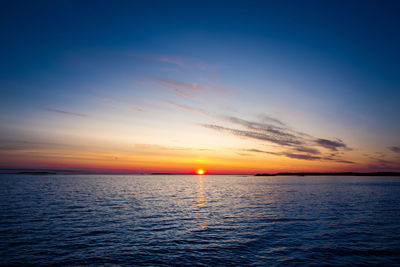 Scenic view of sea against romantic sky at sunset