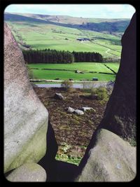 Scenic view of grassy field against sky