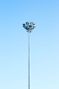 Low angle view of street light against clear blue sky