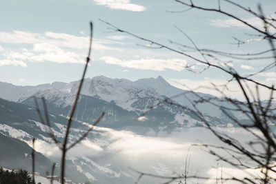 Scenic view of mountains against cloudy sky