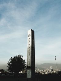 Low angle view of communications tower against sky