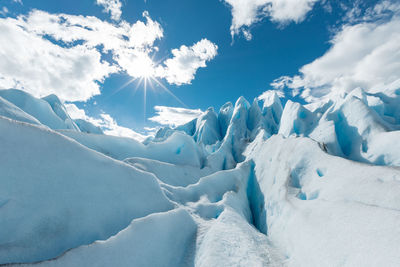 Scenic view of snowcapped landscape against sky