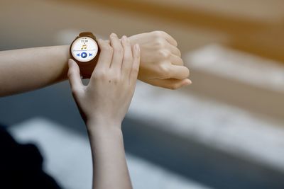 Close-up of woman hand on the wall