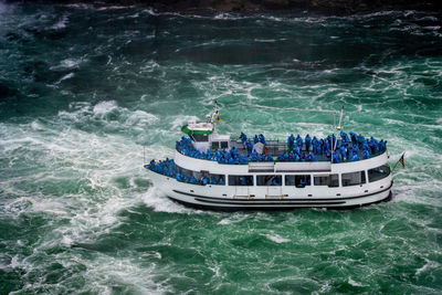 High angle view of people on boat in sea