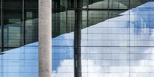 Full frame shot of modern glass building in city