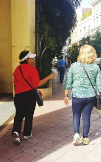 Full length of woman standing by railing