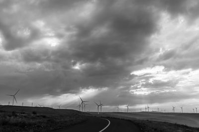 Scenic view of road against dramatic sky