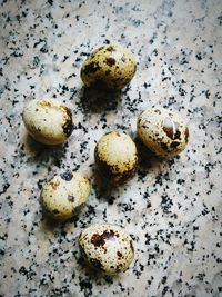 High angle view of quail eggs on table