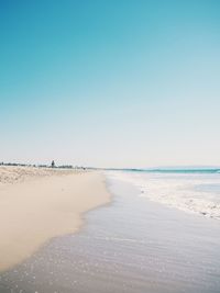 Scenic view of beach against clear sky