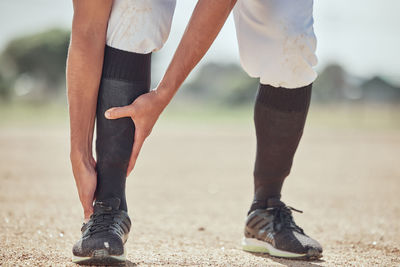 Low section of people walking on footpath