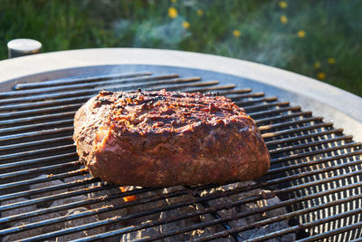 Close-up of meat on barbecue grill