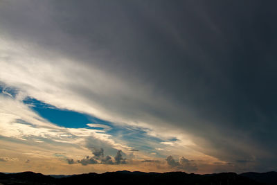 Low angle view of dramatic sky during sunset