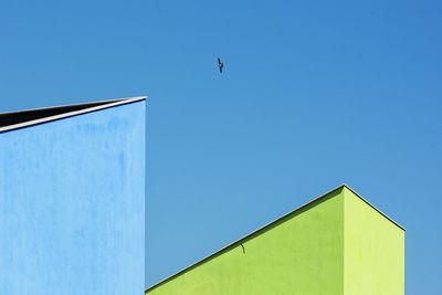 Low angle view of building against clear blue sky