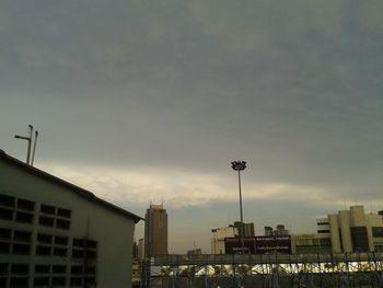 Street and buildings against sky