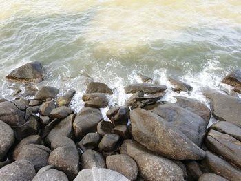 High angle view of rocks in sea