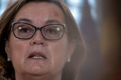 Close-up portrait of woman wearing eyeglasses