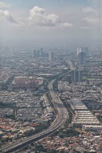 High angle view of street amidst buildings in city