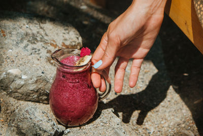 Midsection of woman holding fruit