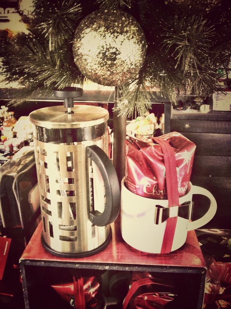 red, tree, chair, table, no people, potted plant, close-up, decoration, day, absence, outdoors, focus on foreground, text, seat, car, built structure, hanging, christmas, still life