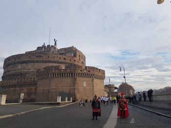 Group of people in front of historical building