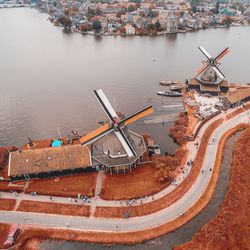 High angle view of windmills by the lake
