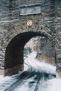 Arch bridge over road in city