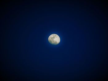 Low angle view of moon against clear sky at night