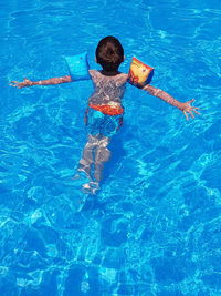 High angle view of boy in swimming pool