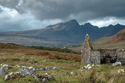 Scenic view of mountains against cloudy sky