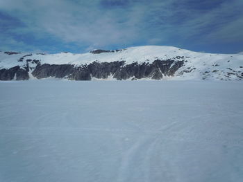 Scenic view of snow covered mountains