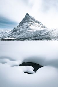 Snow covered mountains against sky