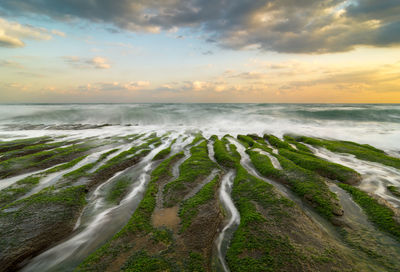 Scenic view of sea against sky during sunset