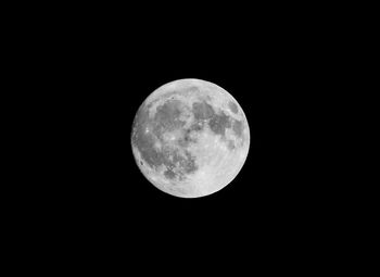 Low angle view of moon against sky at night