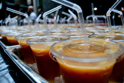 Drink in plastic cups lined up in a tray