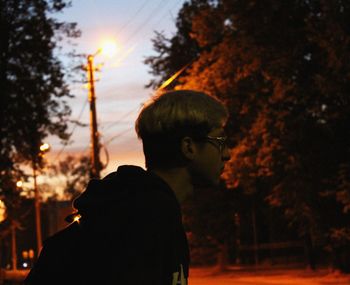 Portrait of silhouette boy against sky during sunset