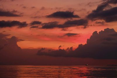 Scenic view of sea against orange sky