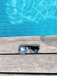 High angle view of sunglasses swimming pool