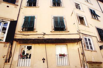 LOW ANGLE VIEW OF RESIDENTIAL BUILDING
