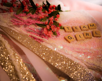 Close-up of pink rose on table