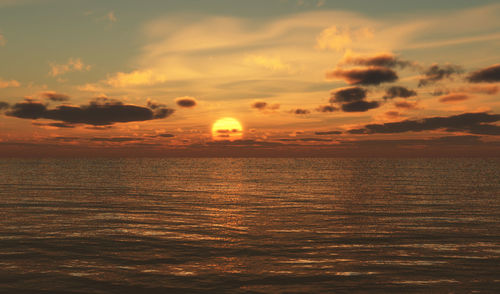 Scenic view of sea against orange sky