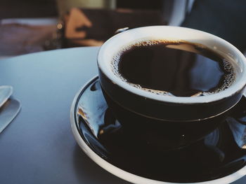 High angle view of coffee cup on table