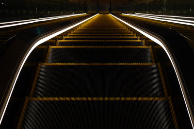 High angle view of illuminated escalator