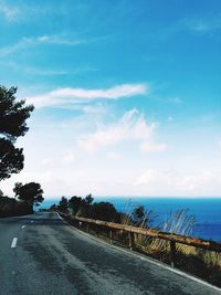 Road by sea against sky